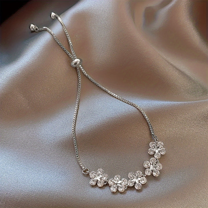 Pulsera Flores Circonitas Oro Blanco