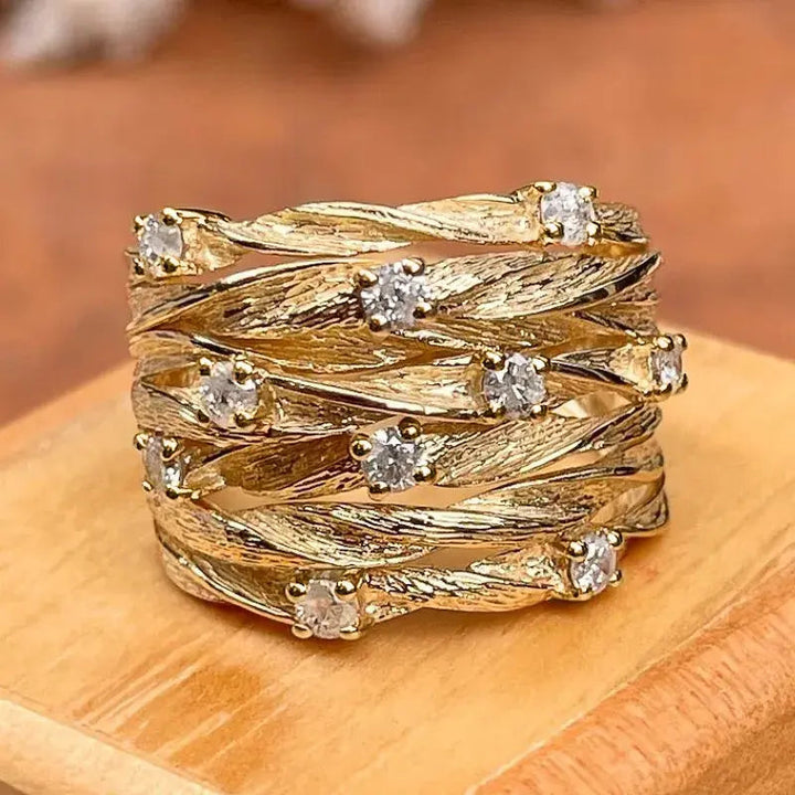 Anillo Entrelazado Brillantes Dorado